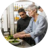 mand and women cooking food