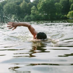Man swimming at a lake